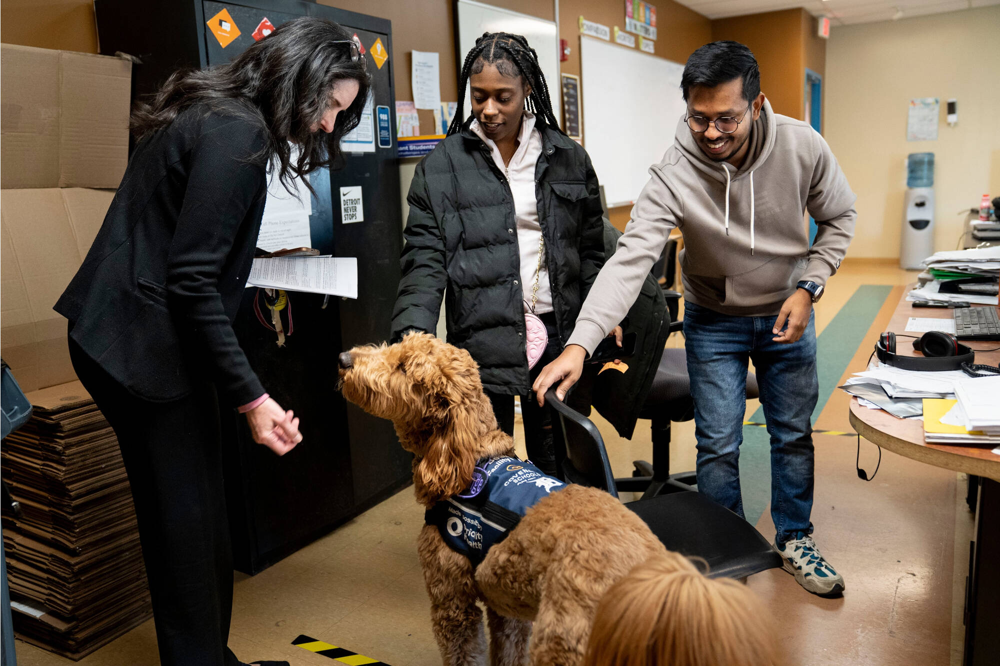 staff and students with Beau the dog